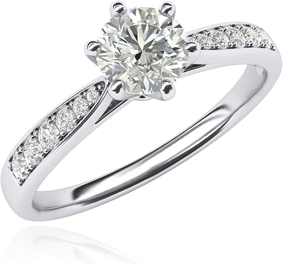 10k white gold and classic engagement ring with a simulated diamond or genuine moissanite. Elegant design with side stones at an affordable price.