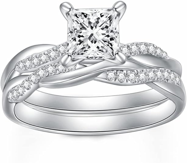 Princess cut wedding ring set for women featuring a 1-1/2 carat moissanite stone with a twisting infinity pave design in sterling silver, available in 10K, 14K, and 18K gold with free engraving option."